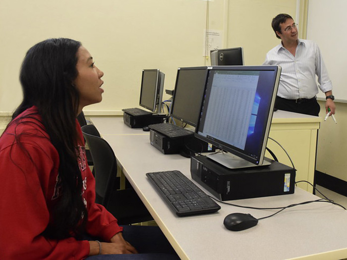 Student Jestena Mattson in class with faculty Dr. Serhat Asci