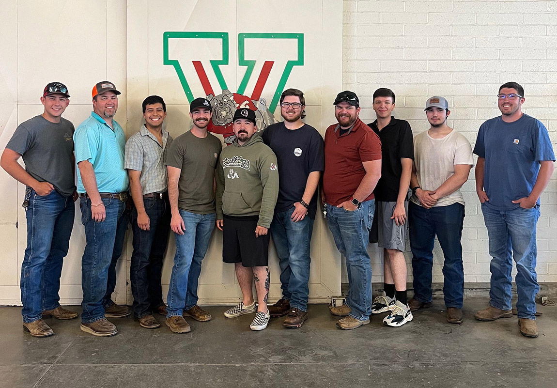 Dr. John Williams, Nick Lara and other mech ag students and faculty