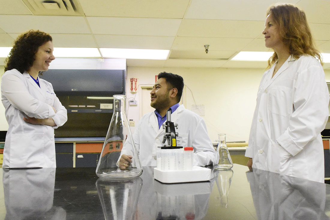 Dr. Lisa Herzig and Dr. Shabnam Pooya and student Jonas Gomez in lab