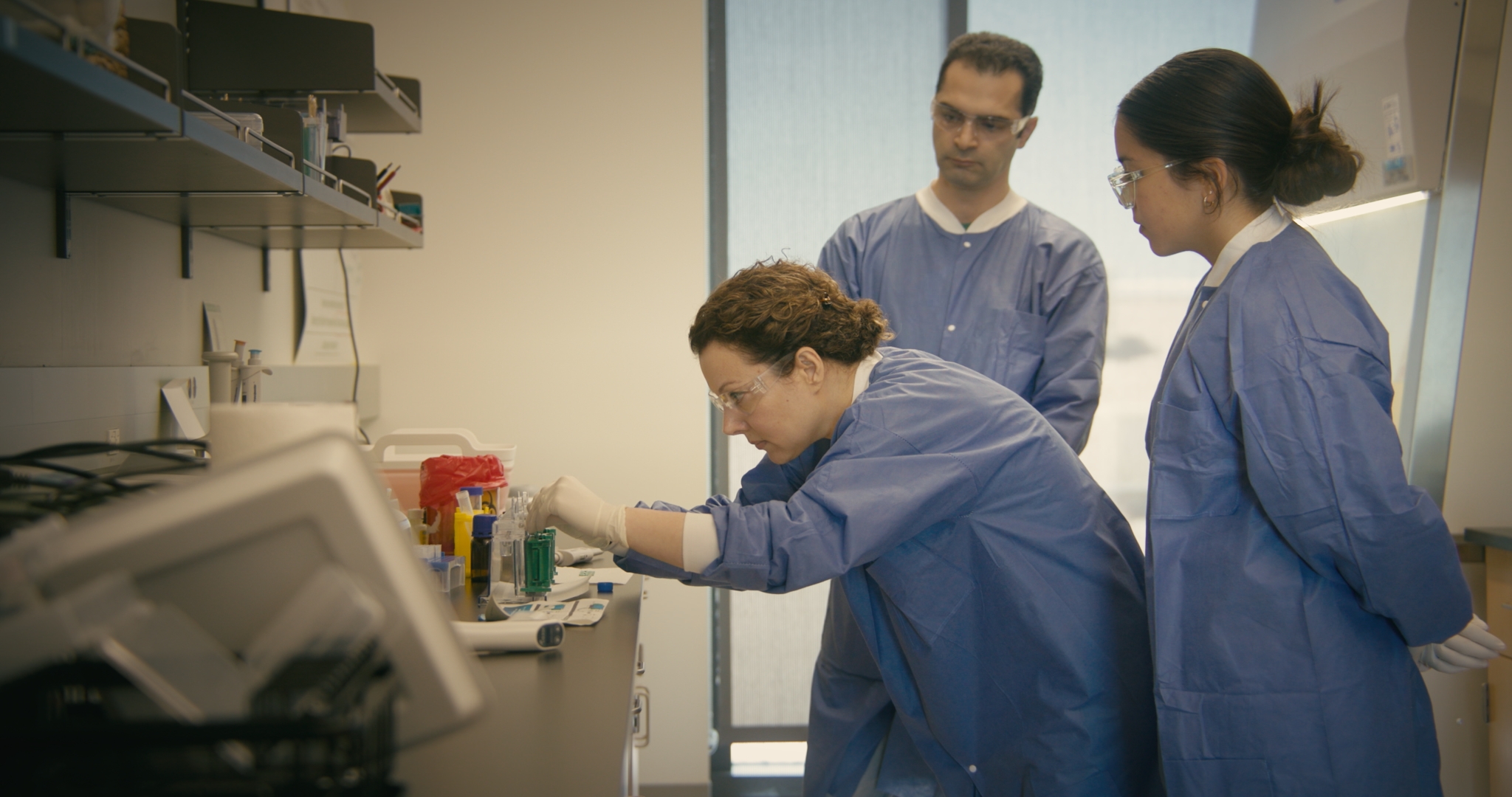 Dr. Lisa Herzig and Dr. Shabnam Pooya and student Jonas Gomez in lab