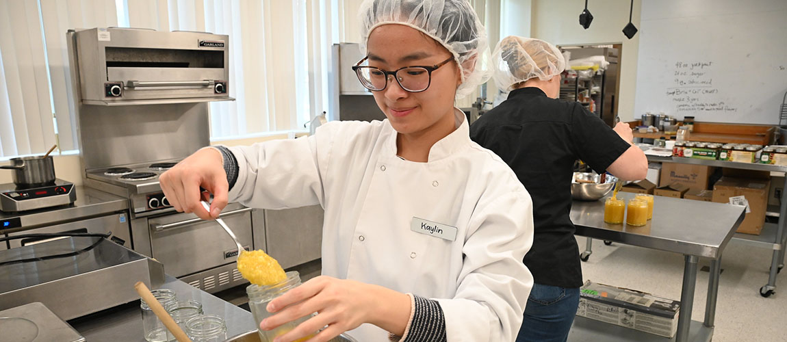 Kaylin Prayitno making jackfruit jam in FSN class lab.