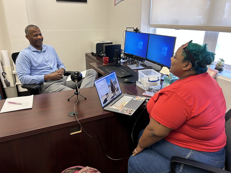 Dean and student recording podcast