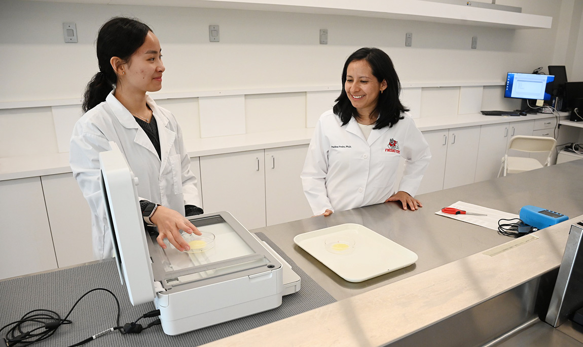 Fresno State food science and nutrition student Kaylin Prayitno and faculty researcher Dr. Paulina Andrea Freire Vásconez conduct research on cheese in the campus Jordan Agricultural Center,
