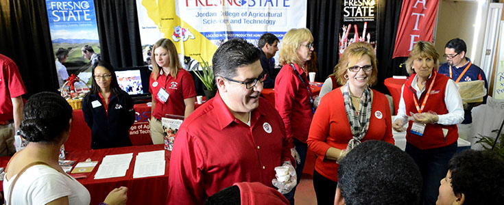 President Joseph & Mary Castro & Interim Dean Sandra Witte at Fresno State booth at World Ag Expo