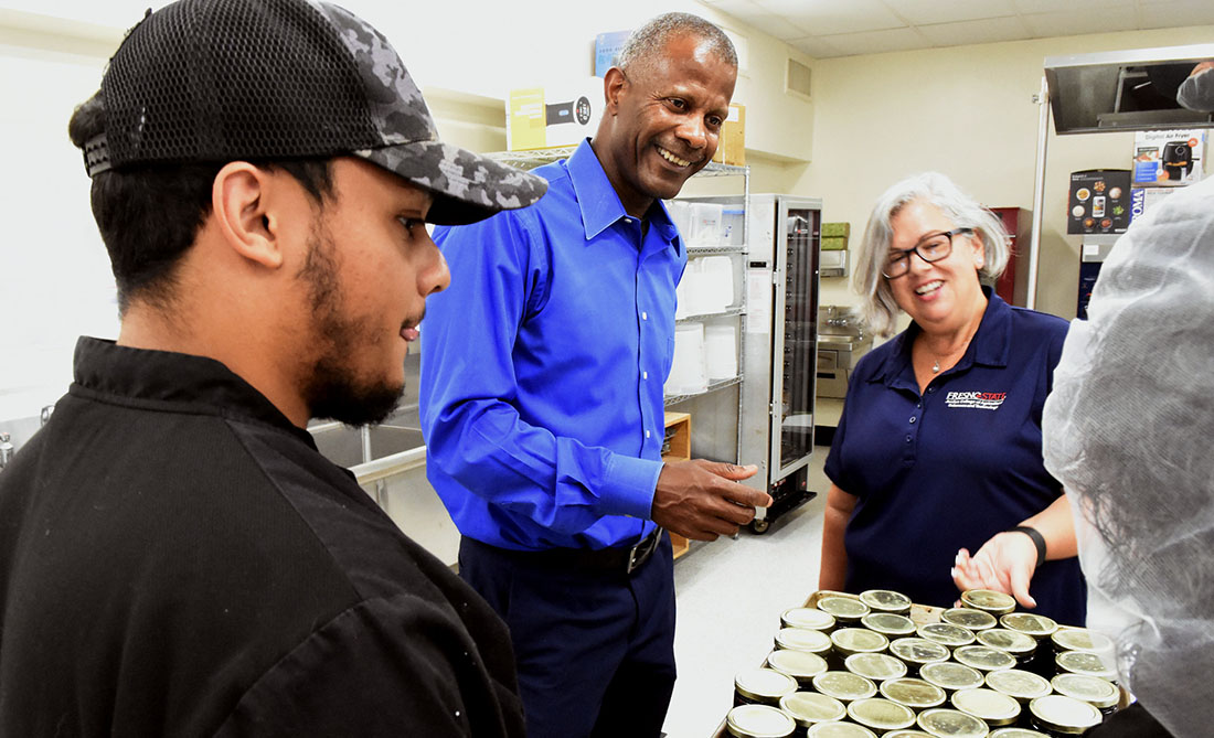 Dean Rolston St. Hilaire, food science and nutrition department chair Dr. Erin Dormedy and student Henry DeJesus