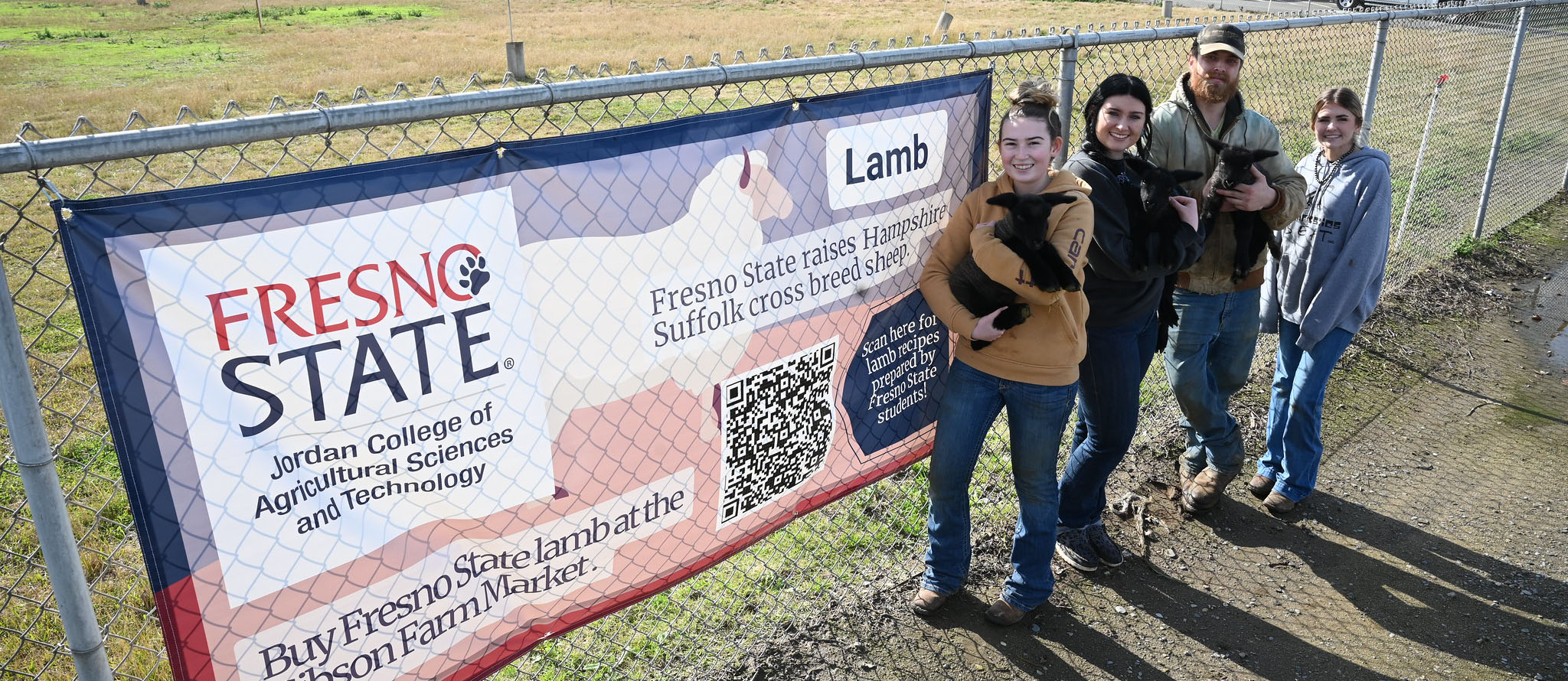Students in front of Lamb sign
