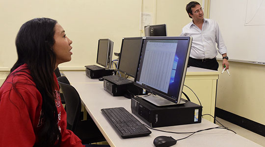 Student Jestena Mattson & Dr. Serhat Asci in computer lab