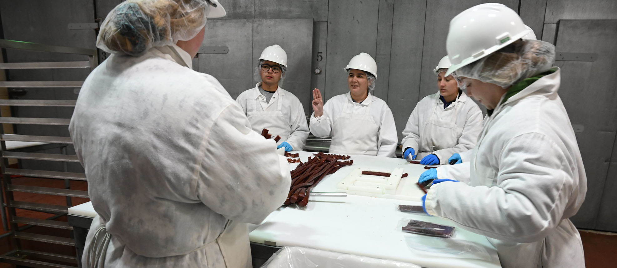 Students making beef sticks in the meat lab
