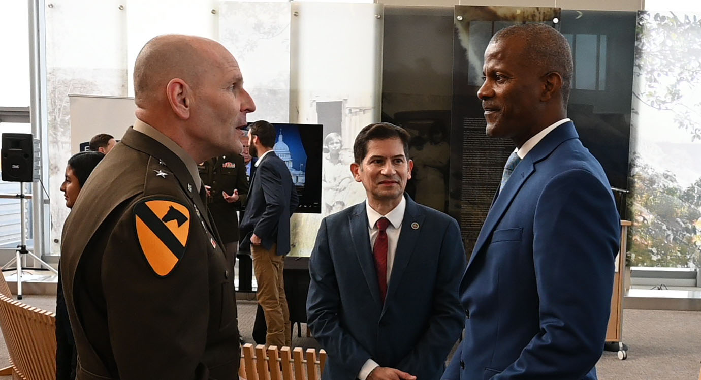 President Saul Jimenez-Sandoval, Jordan College Dean Rolston St. Hilaire, and military member