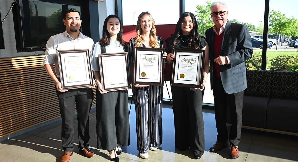 Fresno State students Oswaldo Escobar, Katherine Nathania, Erica Mattingly and Amy Suarez receive an annual ag scholar award from 8th District Assemblyman Jim Patterson