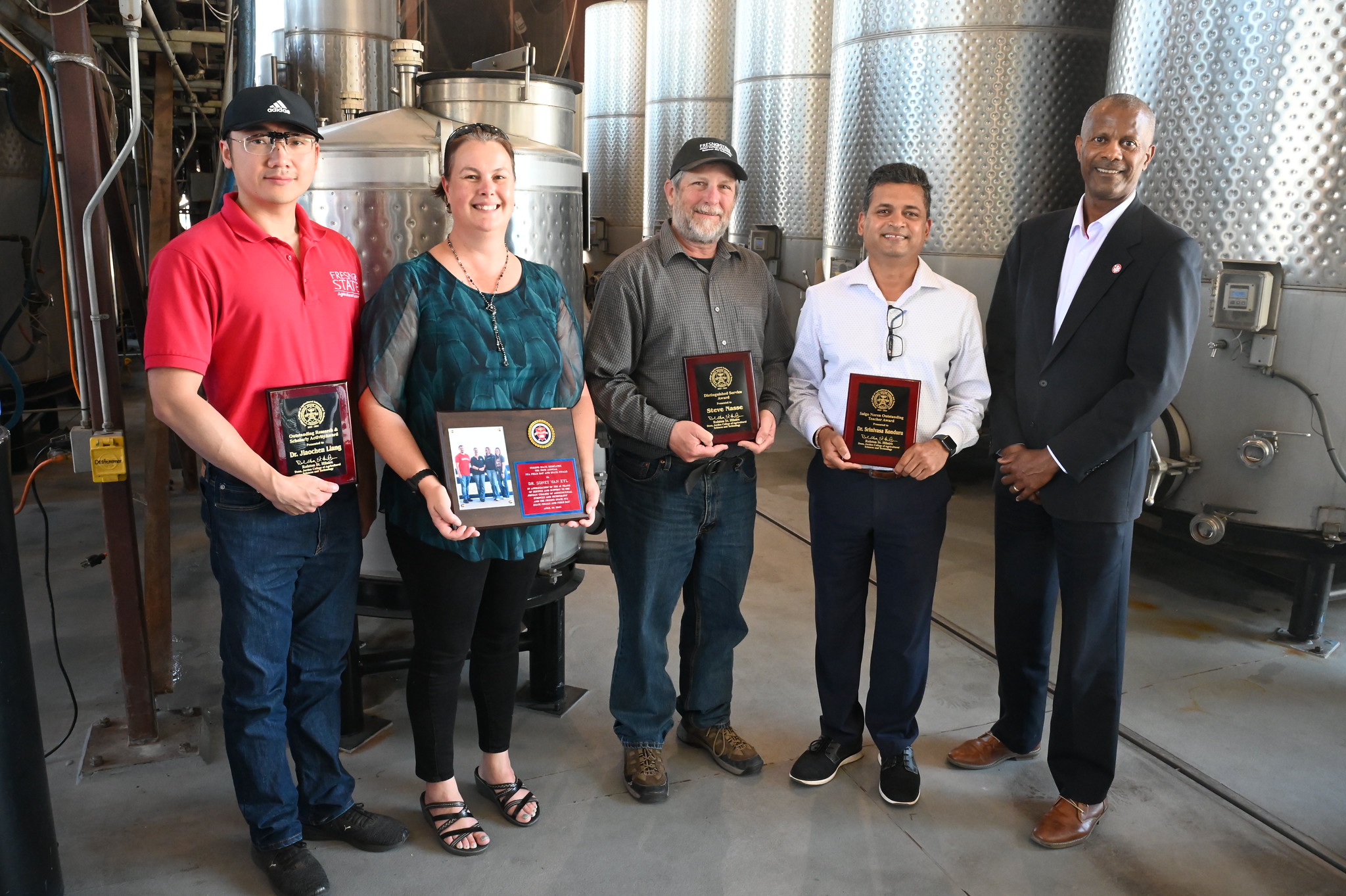 Jordan College Dean Rolston St. Hilaire with agricultural business faculty Dr. Jiaochen (Jason) Liang (Outstanding Research and Scholarly Activity Award), Dr. Sonet Van Zyl (FFA Field Day Service Award), Steve Nasse (Staff Distinguished Service Award) and Dr. Srinivasa Konduru (Salgo Noren Outstanding Teacher Award), Jordan College faculty and staff awards ceremony, May 9, 2024, Photo by Geoff Thurner, Copyright 2024. 