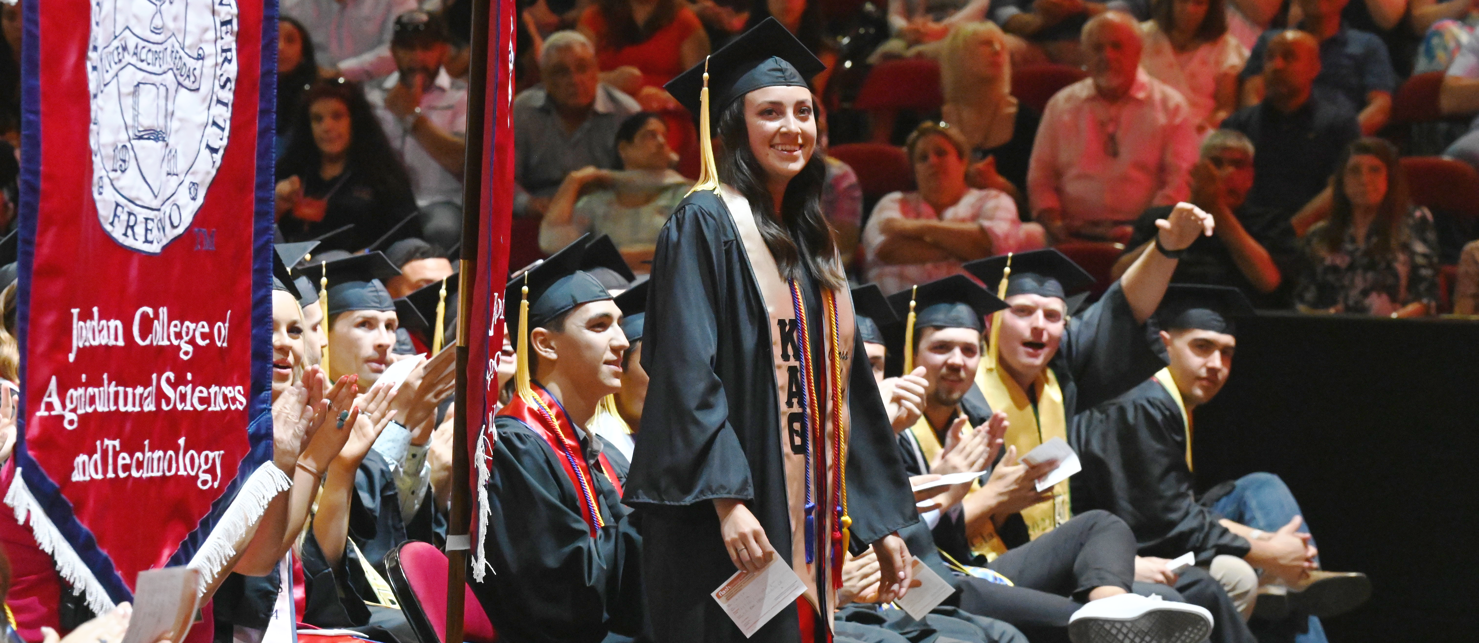 Tatyn Silva standing at graduation