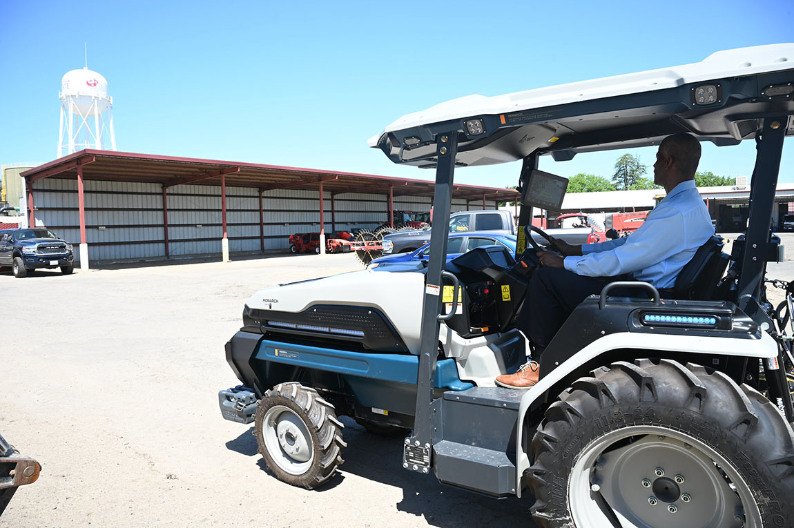 Jordan College Dean Rolston St. Hilaire tests out a new campus farm, electric tractor manufactured by Monarch.