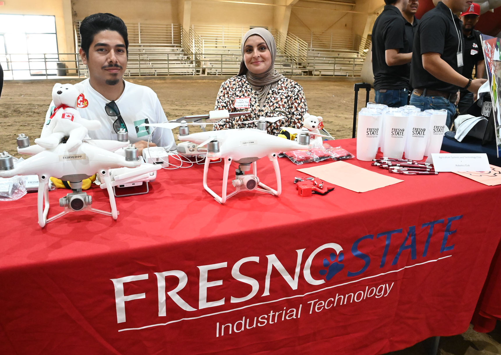 Sara Mekideche and Jose Pimentel at information table for Industrial Technology Department.