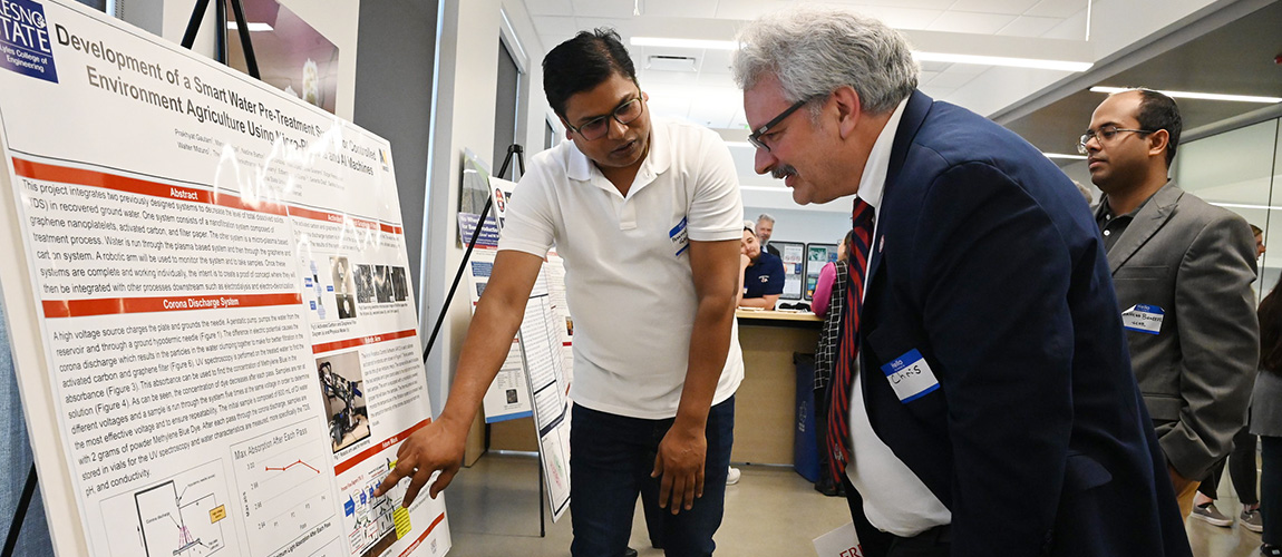 CSM Dean Christopher Meyer learns about student and faculty research.