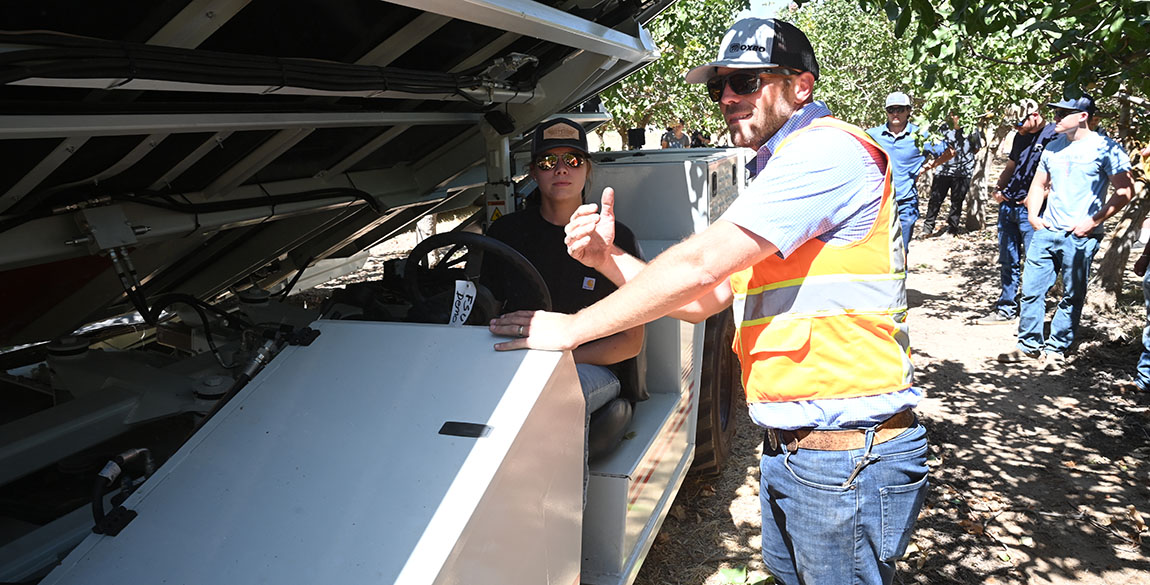 Fresno State students learn how to operate Oxbo pistachio harvest equipment in a campus orchard in the mechanized ag 103 (ag tractors) class.