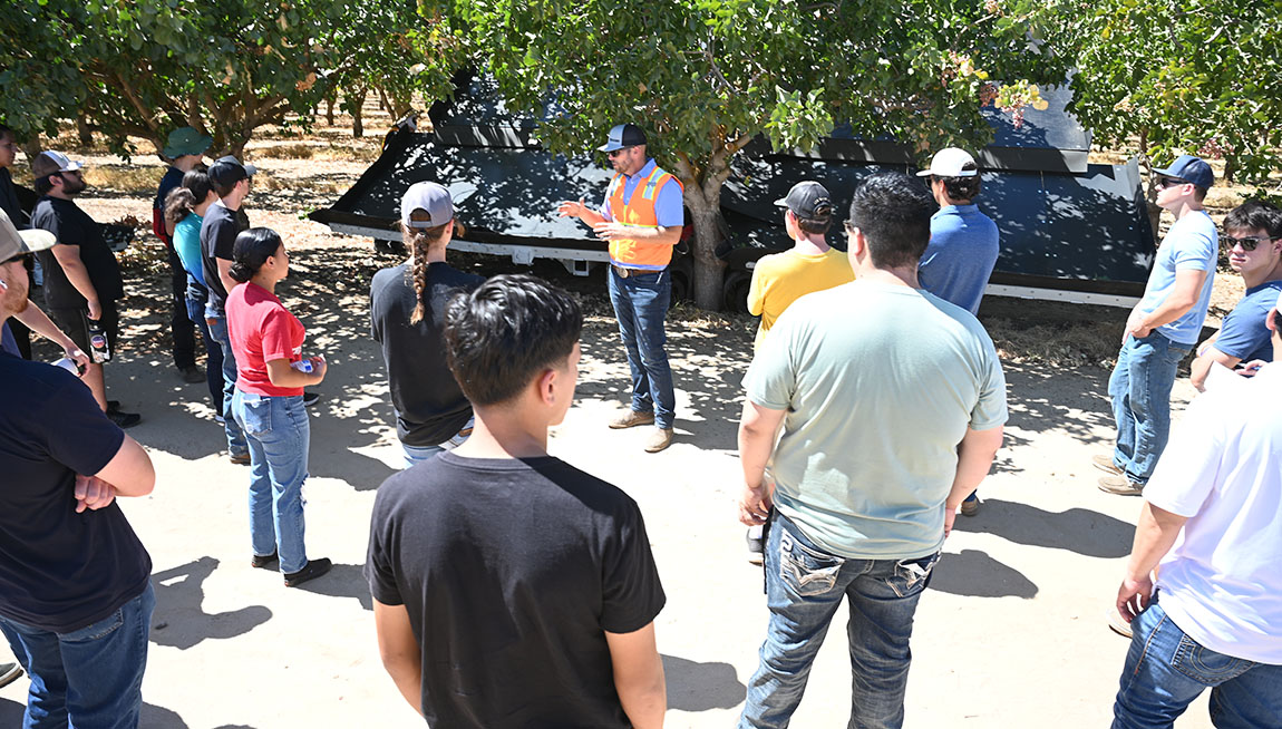 Fresno State students learn how to operate Oxbo pistachio harvest equipment in a campus orchard in the mechanized ag 103 (ag tractors) class.