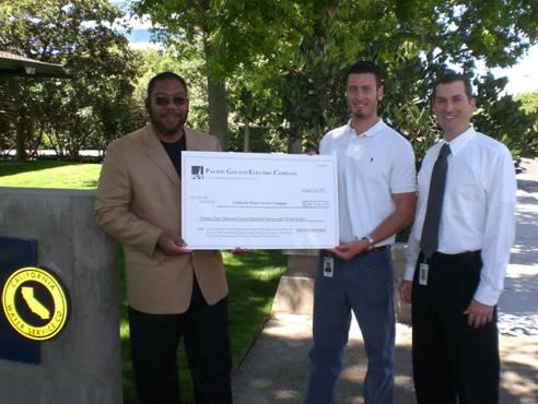 PG&E Senior Account Manager Jorge Alleyne presents a check for $29,716.71 to California Water Service Engineer Stephen Harrison and Chief Engineer Todd Peters