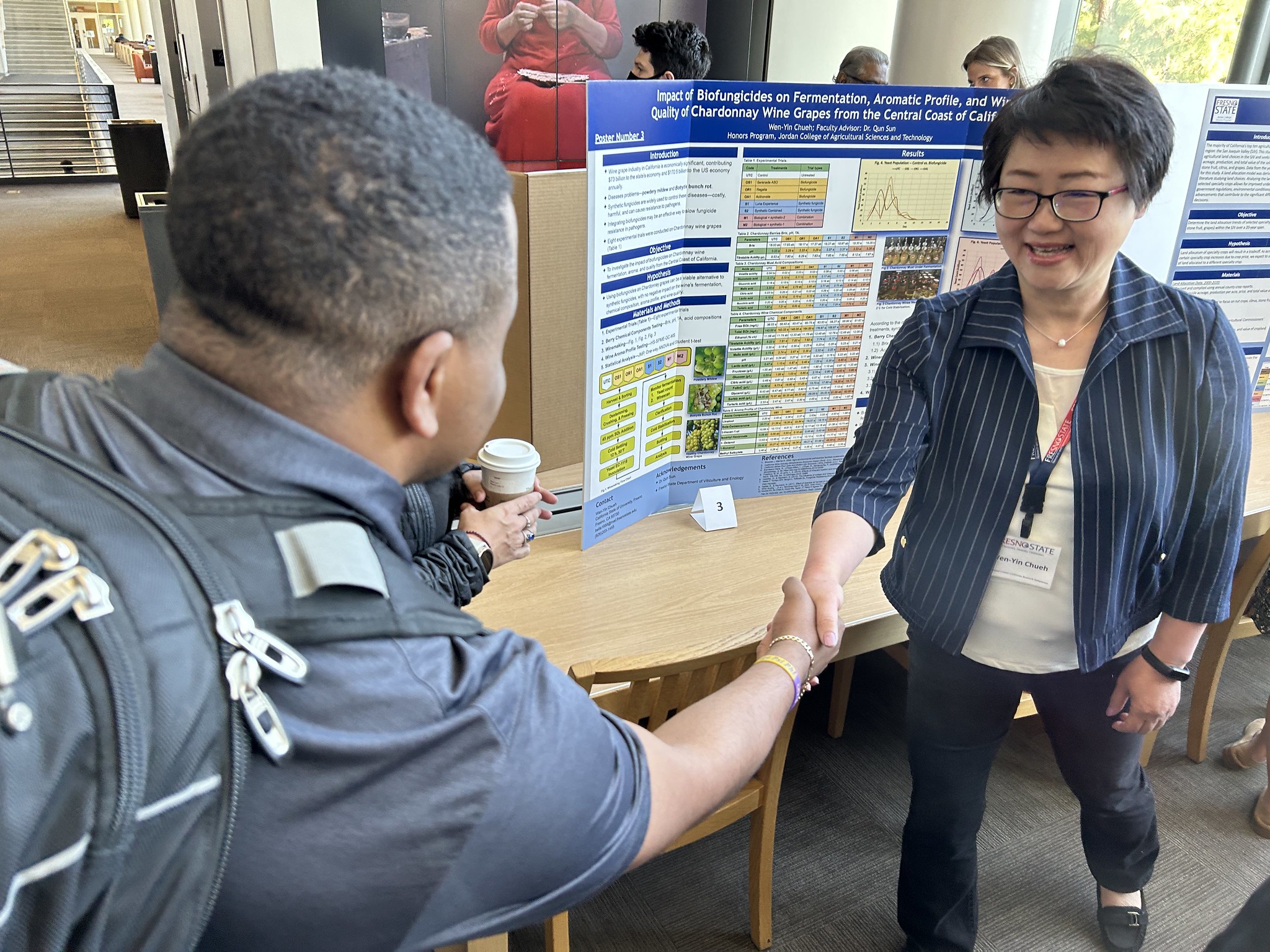 Wen Yin-Chueh makes a research poster preesntation at the Central California Research Symposium